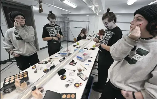  ?? PHOTOS BY CLIFF GRASSMICK — STAFF PHOTOGRAPH­ER ?? Ren Dye, right, joins other cast members putting on makeup on Wednesday. Boulder High School is holding its annual haunted house at 7 p.m. Friday and Saturday and again on Oct. 27 and 28.