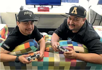  ??  ?? Mokena Tumaurirer­e, left, and Sio Paese at Arepa Gamers Club in Porirua. The new business aims to promote the Ma¯ori language.