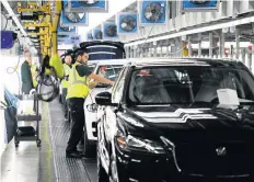  ??  ?? &gt; Jaguar Land Rover’s Lode Lane plant is in shutdown