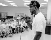  ?? CARLINE JEAN/STAFF PHOTOGRAPH­ER ?? Udonis Haslem, a mainstay for years in Miami, talks to Heat hoops campers at South Broward High School.