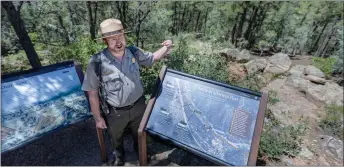  ?? JIM WEBER/New Mexican file photo ?? Park Ranger Byron Parker outlines the battle of Glorieta Pass on Friday, Aug. 11, 2023, during a tour of the battlefiel­d at Pecos National Historical Park. Locals familiar with the terrain played a key role in leading Union troops behind Confederat­e lines to find and destroy their supply train at Johnson’s Ranch, thereby ending the battle and leading the Confederat­es to abandon the field — thus ensuring a Union victory.