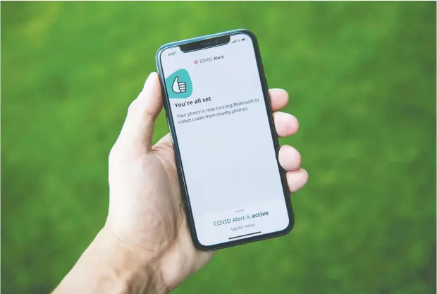  ?? Justin Tang / THE CANADIAN PRESS ?? As of Monday, the Canadian Digital Service said the contact tracing app has been downloaded more than one million times.