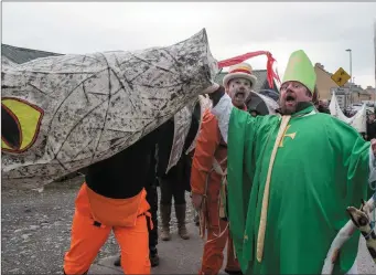  ?? Hugh Horgan meets a foe during the parade. Photo by Christy Riordan ??