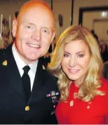  ??  ?? Chief Constable Adam Palmer congratula­ted Wendy Lisogar-Cocchia on her Pacific Autism Family Network luncheon reportedly raising $719,000.