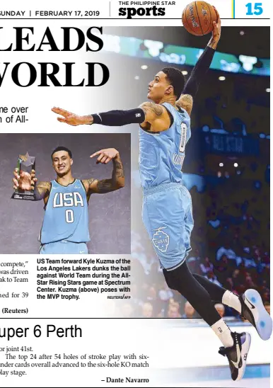  ?? REUTERS/AFP ?? US Team forward Kyle Kuzma of the Los Angeles Lakers dunks the ball against World Team during the AllStar Rising Stars game at Spectrum Center. Kuzma (above) poses with the MVP trophy.