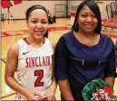  ?? TOM ARCHDEACON / STAFF ?? Sinclair sophomore point guard Nia Martin and mom Monique after Nia’s final regularsea­son home game on Saturday.
