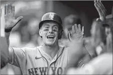  ?? ALEX BRANDON/AP PHOTO ?? New York Mets outfielder Mark Canha celebrates his solo home run with his teammates during the ninth inning of Thursday’s game against the Washington Nationals at Nationals Park in Washington.