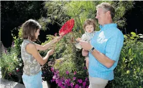  ??  ?? Hole Family From a young age, Emma, left, and Everett Hole have embraced the passion for plants and bugs held by their father Jim, right.