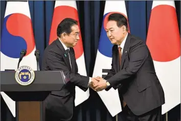  ?? Jung Yeon-je Pool Photo ?? JAPANESE Prime Minister Fumio Kishida, left, and South Korean President Yoon Suk-yeol appear at a news conference Sunday in Seoul. The leaders have pledged to strengthen ties in the face of shared challenges.