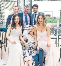  ?? COURTESY OF OLIVIA AYLON ?? Bride Olivia Aylon, left, and family, including groom Matthew Barrett, top left, pose for a photo following their wedding.