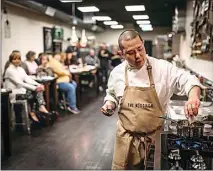  ?? MARGAUX FISCHER PHOTOGRAPH­Y ?? Chef Richard Yoshimura adds honey to a dish while explaining the recipe during an event at The Kitchen. In January, Yoshimura will offer two “Cooking for College” classes geared toward young adults.