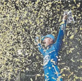  ?? Brian Lawdermilk, Getty Images ?? Kevin Harvick celebrates in victory lane after winning the Monster Energy NASCAR KC Masterpiec­e 400 at Kansas Speedway on Saturday night. It was his fifth win so far this season.