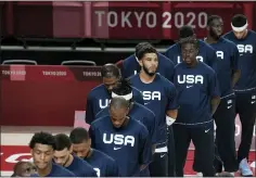  ?? Eric Gay — The Associated Press ?? United States players stand during their national anthem prior to men’s basketball preliminar­y round game between United States and Iran at the 2020 Summer Olympics, Wednesday, July 28, 2021, in Saitama,