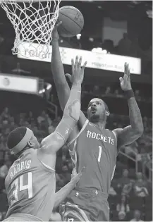  ?? Yi-Chin Lee / Houston Chronicle ?? His Rockets teammates say Trevor Ariza, right, brings veteran leadership to the team as it seeks to win an NBA title.