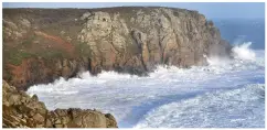  ??  ?? Swept out to sea: Mike Reid was attending a call-out at Porthchape­l Beach, Cornwall, left