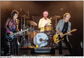  ?? (AP file photo) ?? Charlie Watts and fellow Rolling Stones Ronnie Wood (left) and Keith Richards perform July 15, 2019, in New Orleans. Watts was often ranked with Keith Moon, Ginger Baker and a handful of others as a premier rock drummer.