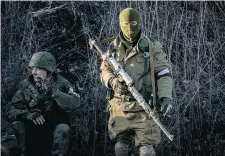  ?? MAXIMILIAN CLARKE/The Associated Press ?? Fierce fighting surged Friday in eastern Ukraine as separatist­s mounted a major offensive to capture a railway hub ahead of a weekend ceasefire.