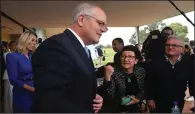  ?? (AP/AAP Image/Mick Tsikas) ?? Australia’s Prime Minister Scott Morrison speaks with people on Friday as he attends a leisure center for a community morning tea while campaignin­g in Perth. More photos at arkansason­line. com/521aussies/.