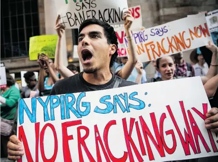  ?? Andrew Burton/Getty Images/Files ?? Protesters demand a statewide ban on fracking on June 30 in New York City. The American Petroleum Institute released new guidelines for improving community relations after New York’s highest court let cities and towns block hydraulic fracturing within...