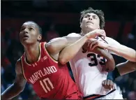  ?? (AP/Charles Rex Arbogast) ?? Maryland forward Julian Reese (10) blocks out Illinois forward Coleman Hawkins during a game Sunday in Champaign, Ill. Reese finished with 20 points and 11 rebounds in Maryland’s 76-67 upset of No. 10 Illinois.