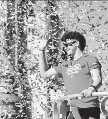  ?? Joe Burbank Orlando Sentinel ?? PATRICK MAHOMES waves to fans during a parade at Walt Disney World Resort a day after Kansas City’s win in Super Bowl LIV. Mahomes, 24, is the youngest quarterbac­k to be named Super Bowl MVP.