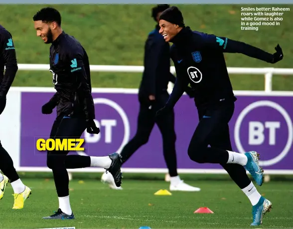  ??  ?? Smiles better: Raheem roars with laughter while Gomez is also in a good mood in training