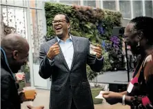  ?? Peter Earl McCollough / Special to The Chronicle ?? San Francisco Foundation CEO Fred Blackwell (center) hangs out with friends Shante Stitt and Retha Robinson.