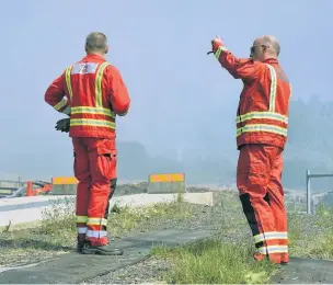  ??  ?? Fire crew assess the situation at Llwydcoed