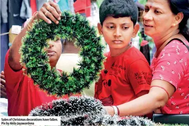  ?? ?? Sales of Christmas decoration­s have fallen. Pix by Akila Jayawarden­a