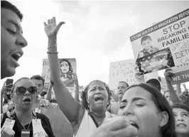  ?? BRYNN ANDERSON/ASSOCIATED PRESS ?? Protesters chant Saturday as they march down the southbound lane of 288th Street to the Homestead Temporary Shelter for Unaccompan­ied Children.