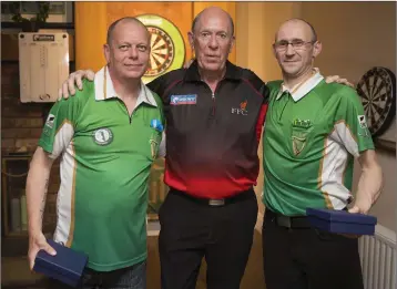  ??  ?? Runners up in the doubles Jason Canavan and Willy Walsh with profession­al John Lowe at the Wicklow Darts presentati­on in the Woodpecker.