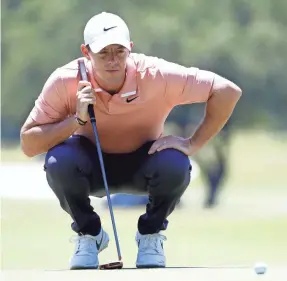  ?? RAYMOND CARLIN III/USA TODAY SPORTS ?? Rory McIlroy lines up his putt on the second green Sunday in the Charles Schwab Challenge, where he finished tied for 32nd.