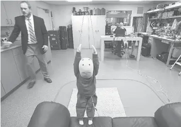  ??  ?? Principal engineer Chris Van Ee, left, and Edward Schatz, test engineer, use a crash test dummy to measure the impact of short falls. The Washington Post and Northweste­rn University’s Medill Justice Project found that of the nearly 2,000 cases of...