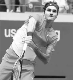  ??  ?? Federer hits a return to Youzhny during their US Open men’s singles match at the USTA Billie Jean King National Tennis Centre in New York.