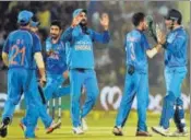  ?? AFP ?? Indian players celebrate a New Zealand wicket