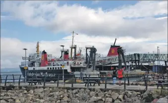  ?? 01_B34strande­d01 ?? The MV Caledonian Isles and MV Isle of Arran which serve the Ardrossan to Brodick route.