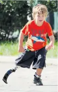  ?? BRAEDEN PETRUK ?? Reid Maxwell runs toward the finish line at last year’s Kids of Steel Triathlon.