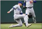  ?? NICK WASS — THE ASSOCIATED PRESS ?? Dodgers left fielder Gavin Lux misses a ball that went for single by the Nationals' Josh Bell,