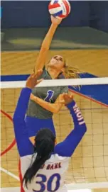  ?? STAFF PHOTO BY DOUG STRICKLAND ?? Sale Creek’s Reagan Ayres sends the ball toward Red Bank’s Bailey Lee during their high school volleyball match Thursday at Red Bank.