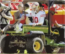  ?? Ap pHOTO ?? UNHAPPY ENDING: Jimmy Garoppolo is carted off the field after apparently tearing his ACL in the 49ers’ 38-27 loss to the Chiefs yesterday in Kansas City, Mo.