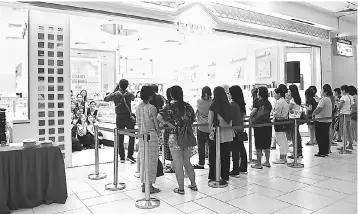  ??  ?? Eager customers are seen gathering in front of the new Etude House atVivacity Megamall Kuching just before its grand opening.The new outlet is the first in East Malaysia, and the third nationwide, to boast Etude House’s brand new, young and vibrant concept.