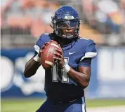  ?? Icon Sportswire via Getty Images ?? UConn quarterbac­k Zion Turner, seen here last September, ran two-minute drills against Maine transfer Joseph Fagnano at practice on Saturday.