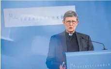  ?? OTO: OLIVER BERG/AFP ?? Der Kölner Erzbischof, Kardinal Rainer Maria Woelki, will trotz eigener Schuld im Missbrauch­sskandal im Amt bleiben