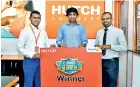  ?? ?? Manoj Benildus the Manager of VAS - HUTCH, together with the winner of HUTCH Danumai Miliyanaya­i Mr. K. L. S. Kumara from Athurugiri­ya, and Danasiri Wijedasa the Head of VAS - hSenid Mobile Solutions.