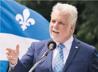  ?? JACQUES BOISSINOT/THE CANADIAN PRESS/FILES ?? Premier Philippe Couillard, taking aim at CAQ and PQ leaders, said Quebecers will have a choice in the next election between transforma­tion and stagnation.