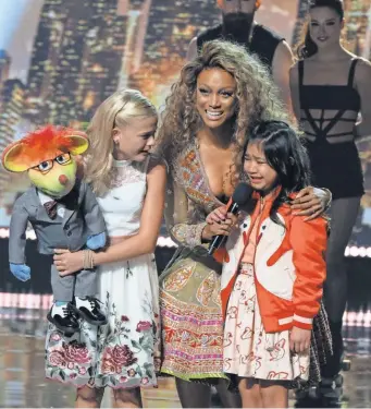  ?? JUSTIN LUBIN, NBC ?? Tyra Banks sheds her fierce TopModel image to play stagemom on AGT.