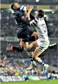  ??  ?? Leaping ahead: Adam Byrne, of Leinster, catches the ball ahead of Darren Atkins