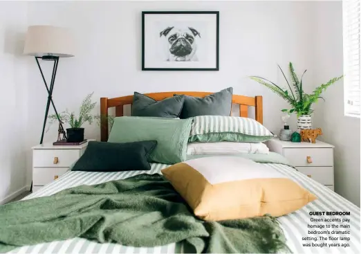  ??  ?? GUEST BEDROOM
Green accents pay homage to the main bedroom’s dramatic setting. The floor lamp was bought years ago.