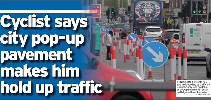  ?? CHRIS GORDON ?? CONFUSION: A cyclists has said he is holiding up traffic by using the only lane available, as pop-up pavements remain on Belgrave Road, Leicester