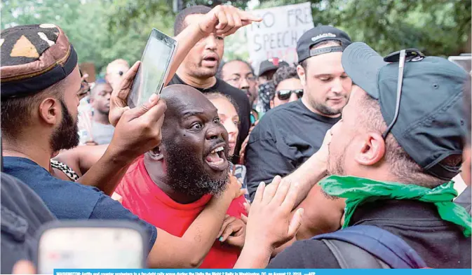  ??  ?? WASHINGTON: Antifa and counter protesters to a far-right rally argue during the Unite the Right 2 Rally in Washington, DC, on August 12, 2018.